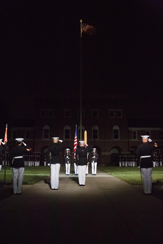 The United States Marine Corps Color Guard performs during the Evening Parade at Marine Barracks Washington, D.C., Aug. 26, 2016. The guest of honor for the parade was the Honorable Ashton B. Carter, Secretary of Defense, and the hosting official was Gen. Robert B. Neller, commandant of the Marine Corps. (Official Marine Corps photo by Lance Cpl. Robert Knapp/Released)