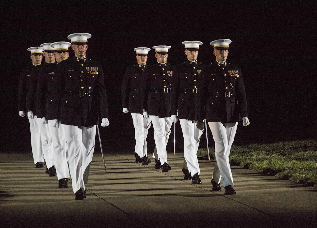Marines of Marine Barracks Washington, D.C., march during the final Evening Parade at Marine Barracks Washington, D.C., Aug. 26, 2016. The guest of honor for the parade was the Honorable Ashton B. Carter, Secretary of Defense, and the hosting official was Gen. Robert B. Neller, commandant of the Marine Corps. (Official Marine Corps photo by Lance Cpl. Robert Knapp/Released)