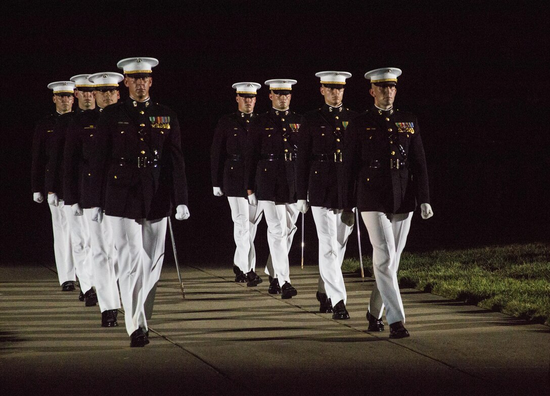 Marines of Marine Barracks Washington, D.C., march during the final Evening Parade at Marine Barracks Washington, D.C., Aug. 26, 2016. The guest of honor for the parade was the Honorable Ashton B. Carter, Secretary of Defense, and the hosting official was Gen. Robert B. Neller, commandant of the Marine Corps. (Official Marine Corps photo by Lance Cpl. Robert Knapp/Released)