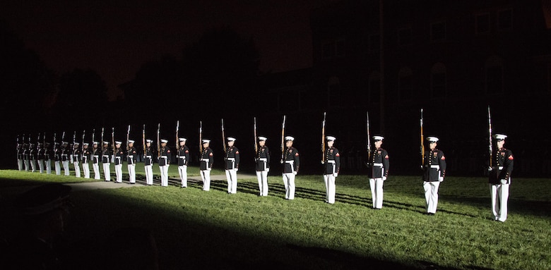 The United States Marine Corps Silent Drill Platoon performs during the Evening Parade at Marine Barracks Washington, D.C., Aug. 26, 2016. The guest of honor for the parade was the Honorable Ashton B. Carter, Secretary of Defense, and the hosting official was Gen. Robert B. Neller, commandant of the Marine Corps. (Official Marine Corps photo by Lance Cpl. Robert Knapp/Released)