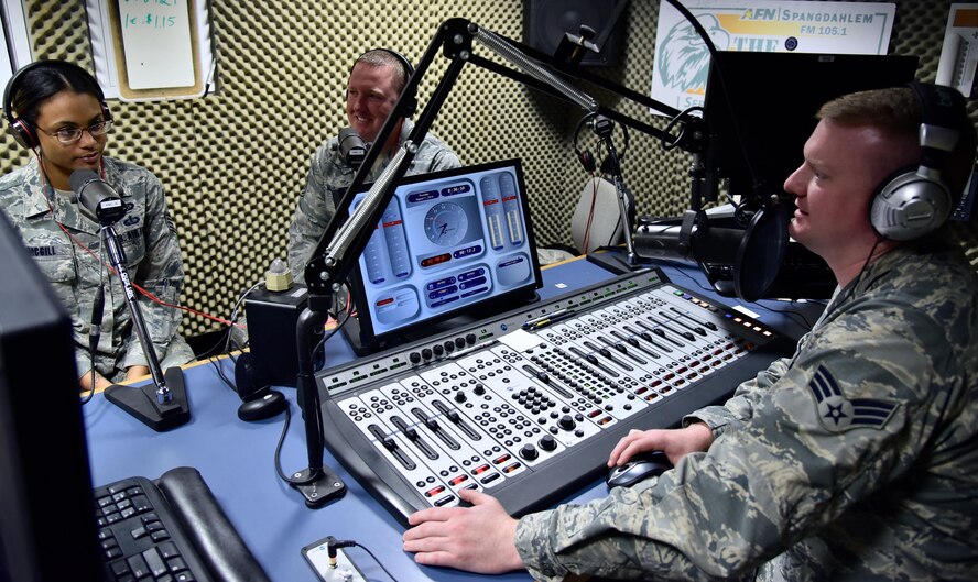 Tech. Sgt. Anthony Mckee, center, 932nd Airlift Wing operational safety specialist and Staff Sgt. Brittany McGill, 52nd Fighter Wing operational safety specialist join DJ Sandman, Senior Airman Steven Adkins, 52nd FW broadcaster, for the weekly safety report on American Forces Network, Spangdahlem FM 105.1 The Eagle, Spangdahlem Air Base, Germany, Aug. 11, 2016.  McKee spent his 2 weeks annual training at the 52nd FW safety office helping them with various inspections and learning more about Air Force safety overseas.  (U.S. Air Force photo by Tech. Sgt. Christopher Parr)