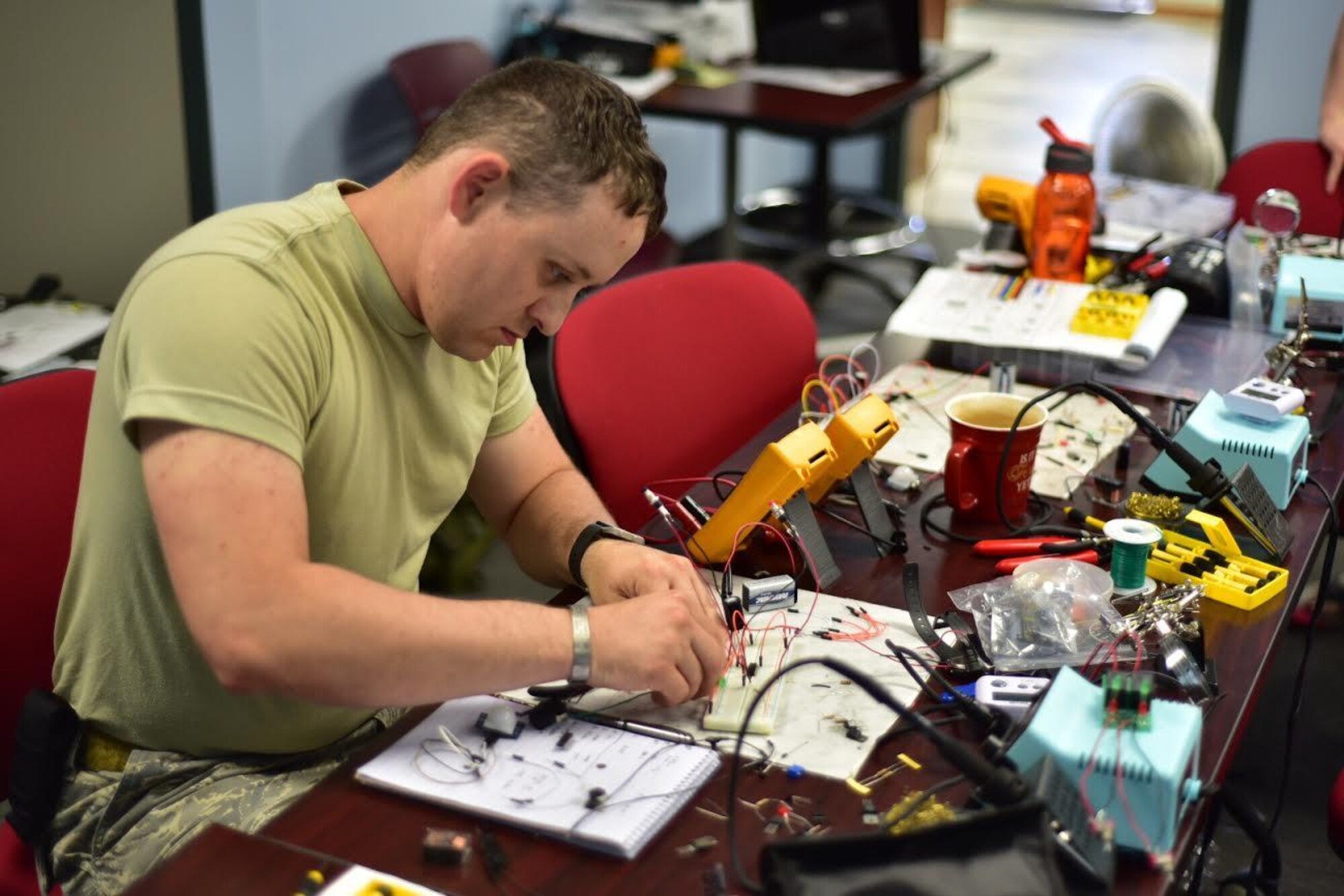 Tech. Sgt. Aaron Clark, EOD team leader, 914th Airlift Wing Civil Engineer Squadron, creates components for a fake improvised explosive device during training on base, August 11, 2016. The exercise was held to teach members how to identify and dismantle IEDs. (U.S. Air Force photo by Staff Sgt. Richard Mekkri/released)