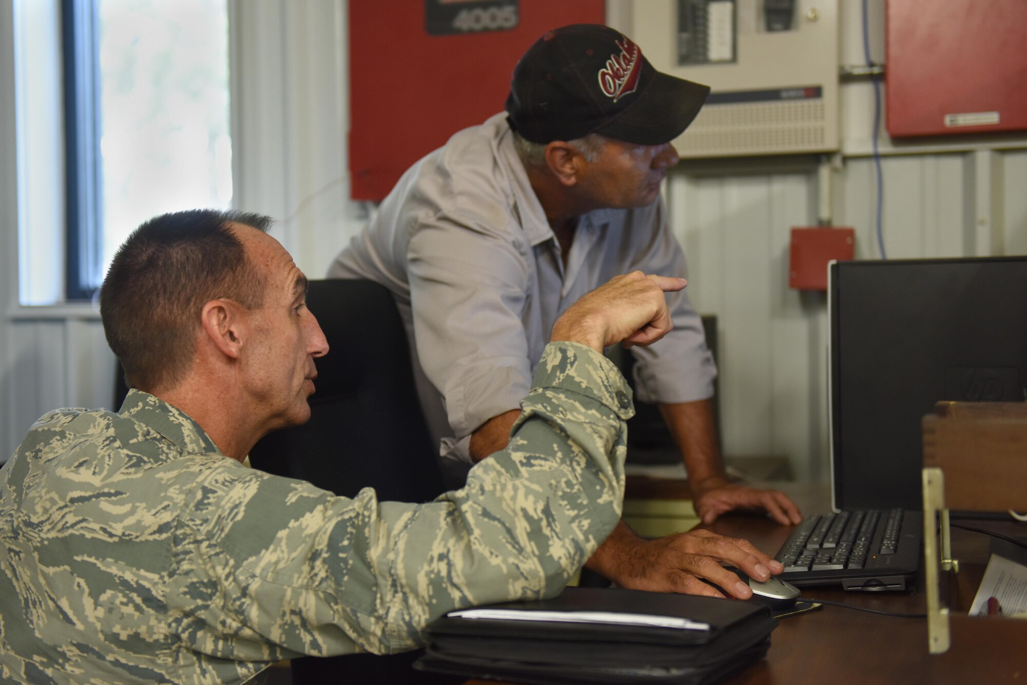 Maj. Gen. Scott Zobrist (left), Ninth Air Force commander, and Kenton Phillpott (right), Civil Engineering Squadron heating, ventilation and air conditioning civilian work leader, discuss HVAC systems and repair during a tour, Aug. 23, 2016, at Seymour Johnson Air Force Base, North Carolina. Zobrist visited 13 squadrons at Seymour Johnson AFB and took note of each squadron’s mission, obstacles and achievements. (U.S. Air Force photo by Airman 1st Class Ashley Williamson)