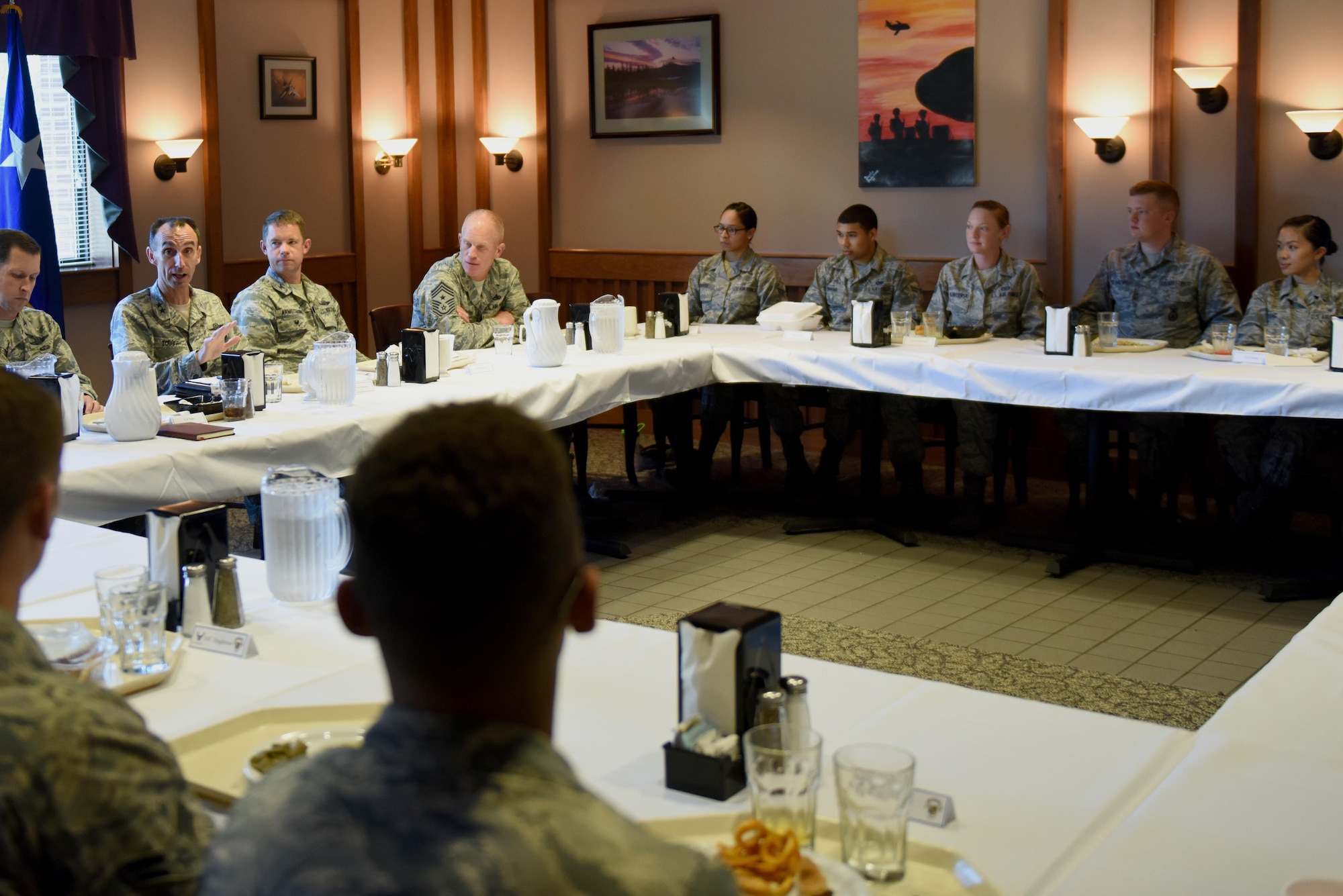 Maj. Gen. Scott Zobrist, Ninth Air Force commander, dines with dorm Airmen during a tour, Aug. 23, 2016, at Seymour Johnson Air Force Base, North Carolina. Zobrist and Team Seymour leadership, spoke with Airmen about what inspired them to join the Air Force. (U.S. Air Force photo by Airman 1st Class Ashley Williamson)