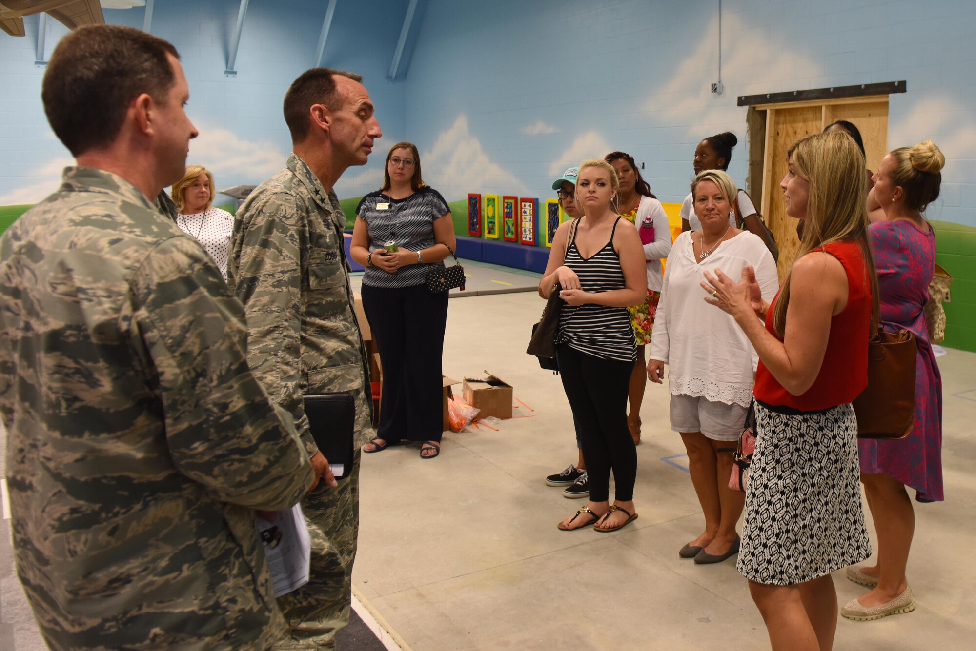 Maj. Gen. Scott Zobrist, Ninth Air Force commander, and members of the Key Spouse Program discuss communication issues and base improvements during an immersion tour, Aug. 23, 2016, at Seymour Johnson Air Force Base, North Carolina. Zobrist had the opportunity to talk to key spouses and Airmen about providing for today, preparing for the future, and protecting the foundation of air power. (U.S. Air Force photo by Airman 1st Class Ashley Williamson) 