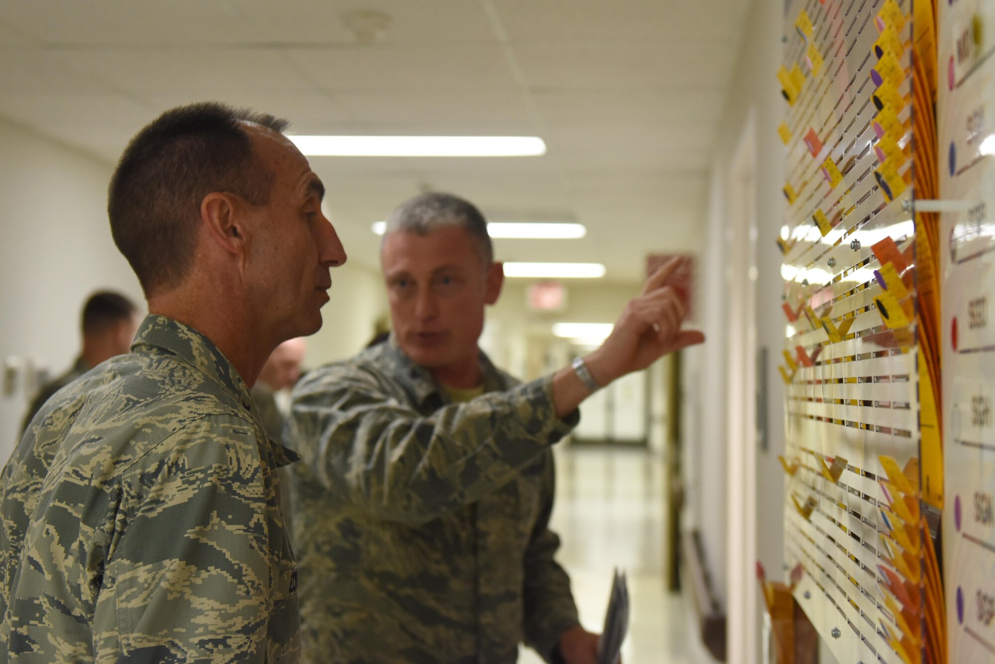 Maj. Gen. Scott Zobrist (left), Ninth Air Force commander, and Col. Paul Conner, 4th Medical Group commander, discuss the changes that have been, and still need to be made, throughout the group during an immersion tour, Aug. 23, 2016, at Seymour Johnson Air Force Base, North Carolina. During the tour, Connor presented a slideshow of each of the squadrons’ improvements and briefed Zobrist on day-to-day happenings. (U.S. Air Force photo by Airman 1st Class Ashley Williamson)