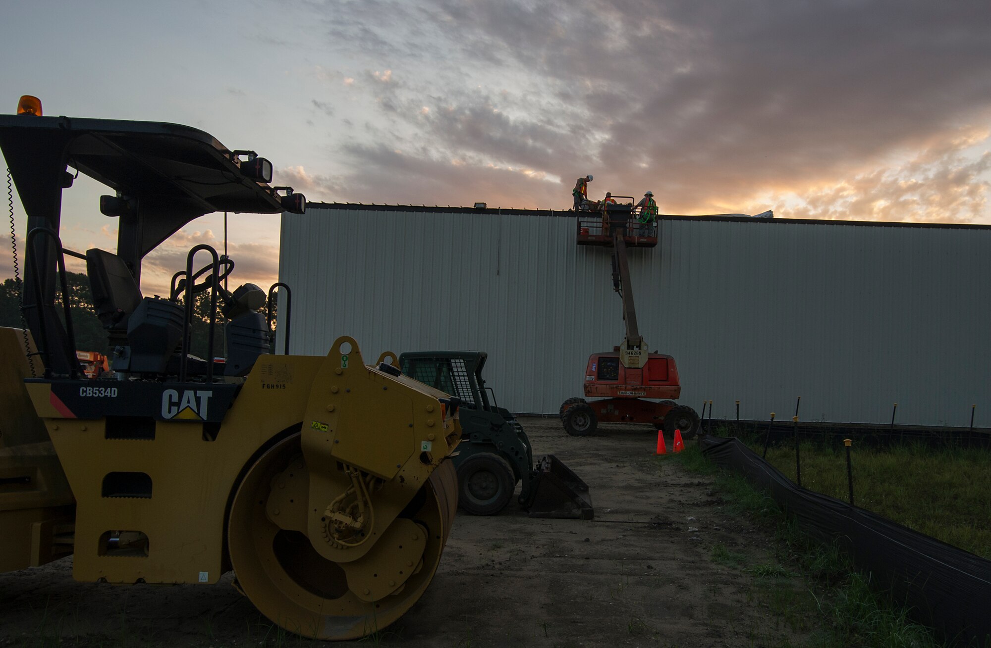 RED HORSE Reservists work on the roof of a new storage building July 17 that they are constructing at Joint Base Charleston, S.C. Members of the 556th RHS from Hurlburt Field, Florida, 555th RHS from Nellis Air Force Base, Nevada, 567th RHS from Seymour Johnson AFB, North Carolina, and the 628th Civil Engineer Squadron at Joint Base Charleston, joined the 560th RHS over a 6 month period to construct a 4,800 square-foot steel frame storage facility at Joint Base Charleston this summer. (U.S. Air Force photo by Michael Dukes)