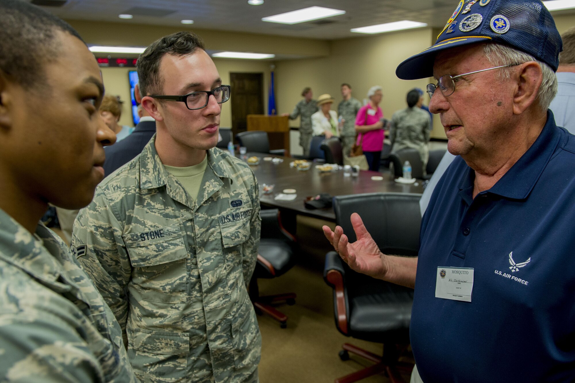 A Korean War veteran and Mosquito member Al Jorgenson, talk to Scott Air Force Base Airmen about his experience in the military, Aug. 26, 2016, Scott AFB, Illinois. The Korean War Mosquitos visited Scott to learn about the present day Air Force and the installation, and the members shared their many stories about their jobs and missions as radio operators and pilots during the Korean War. (U.S. Air Force photo by Senior Airman Joshua Eikren)