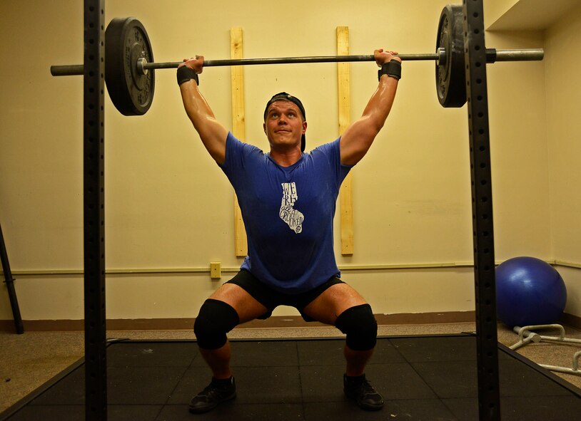 U.S. Air Force Staff Sgt. Matthew Garner, 20th Security Forces Squadron combat arms instructor, lifts weights in the combatives room at Shaw Air Force Base, S.C., Aug. 31, 2016. The combatives room offers classes such as CrossFit, jiujitsu, and boxing. (U.S. Air Force photo by Airman BrieAnna Stillman)