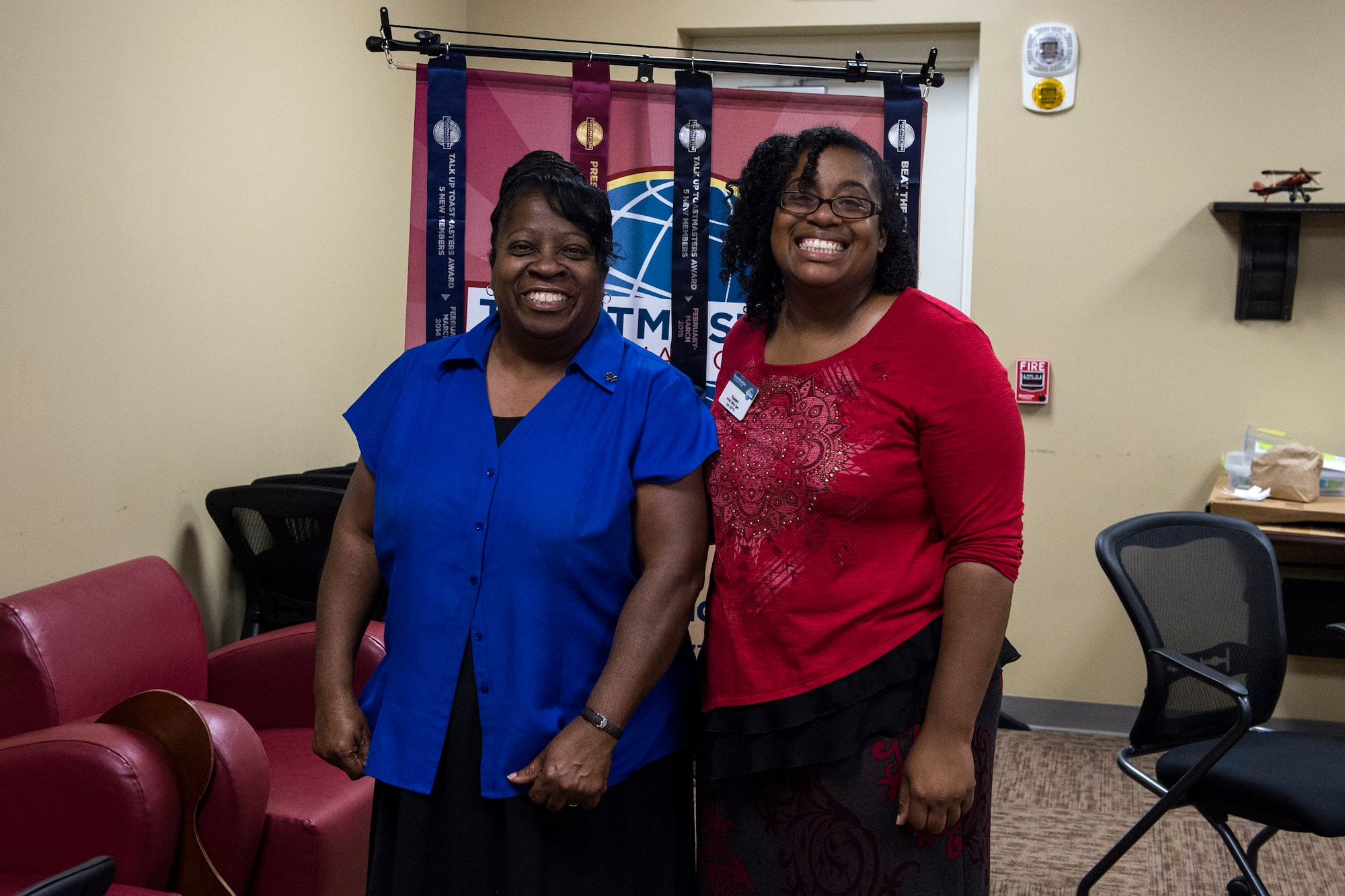 Barbara Miller, 23d Contracting Squadron contracting officer, left, poses for a photo with Katrice Colvin, 23d Force Support Squadron base training manager, right, after receiving her Toastmasters International certified judge pin, Aug. 25, 2016, at Moody Air Force Base, Ga. Certified judges pick winners during speech competitions for Toastmasters International and must successfully complete a training seminar to earn the title. (U.S. Air Force photo by Airman 1st Class Janiqua P. Robinson)