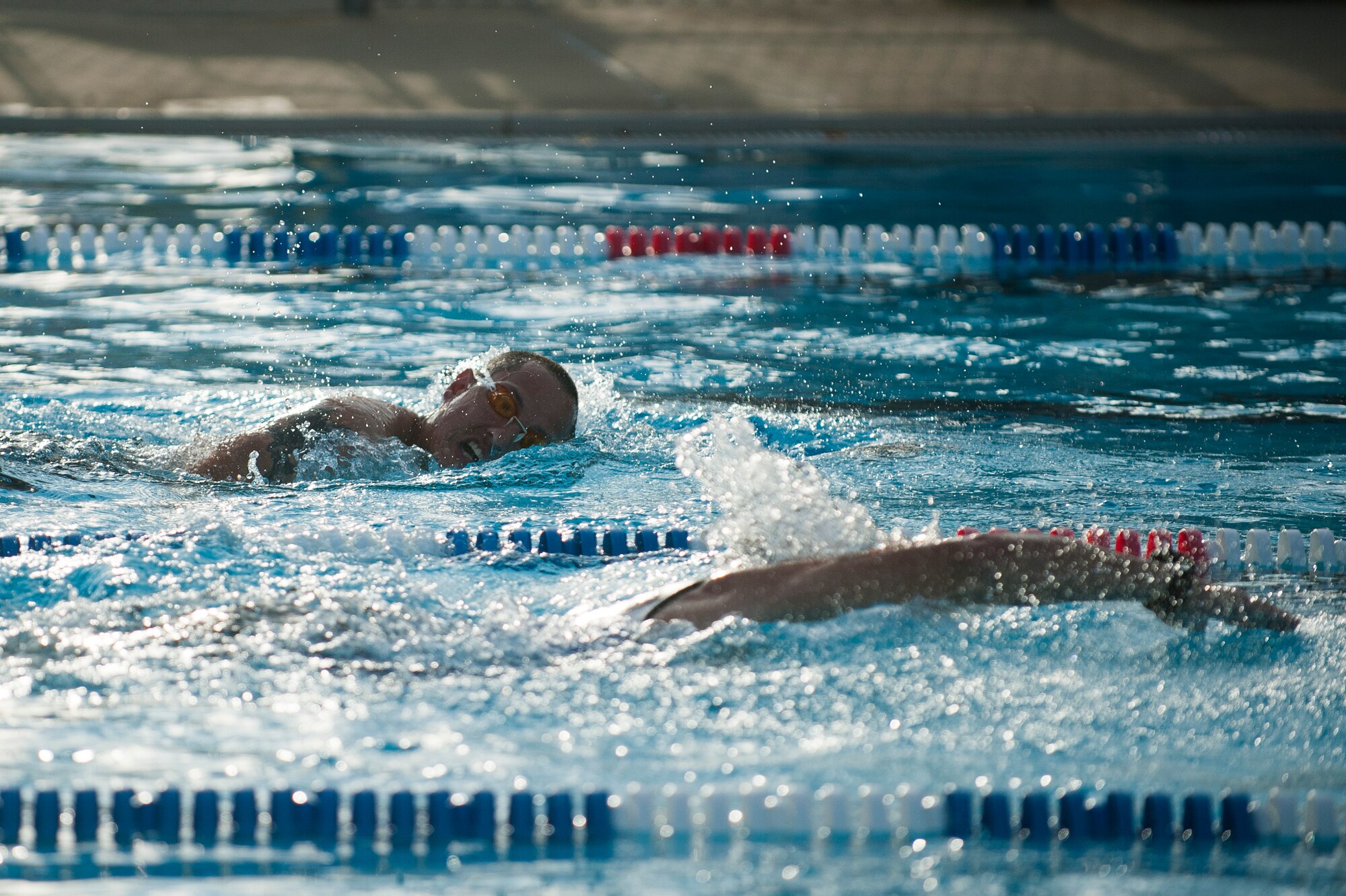 Team Scott members participate in the swim portion of the Surface Warrior Challenge at Scott Air Force Base, Ill., Aug. 27, 2016. The triathlon was hosted by the Military Surface Deployment and Distribution Command and featured both a full and miniature triathlon which included running, bicycling and swimming. (U.S. Air Force photo by Staff Sgt. Clayton Lenhardt/Released)