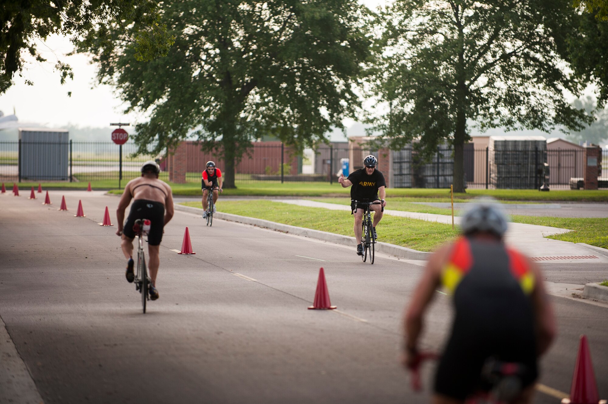 Team Scott members participate in the bike portion of the Surface Warrior Challenge at Scott Air Force Base, Ill., Aug. 27, 2016. The event, also known as the Tour de Scott, featured a triathlon consisting of running, bicycling and swimming that participants could compete in individually or as a member of a team. (U.S. Air Force photo by Staff Sgt. Clayton Lenhardt/Released)