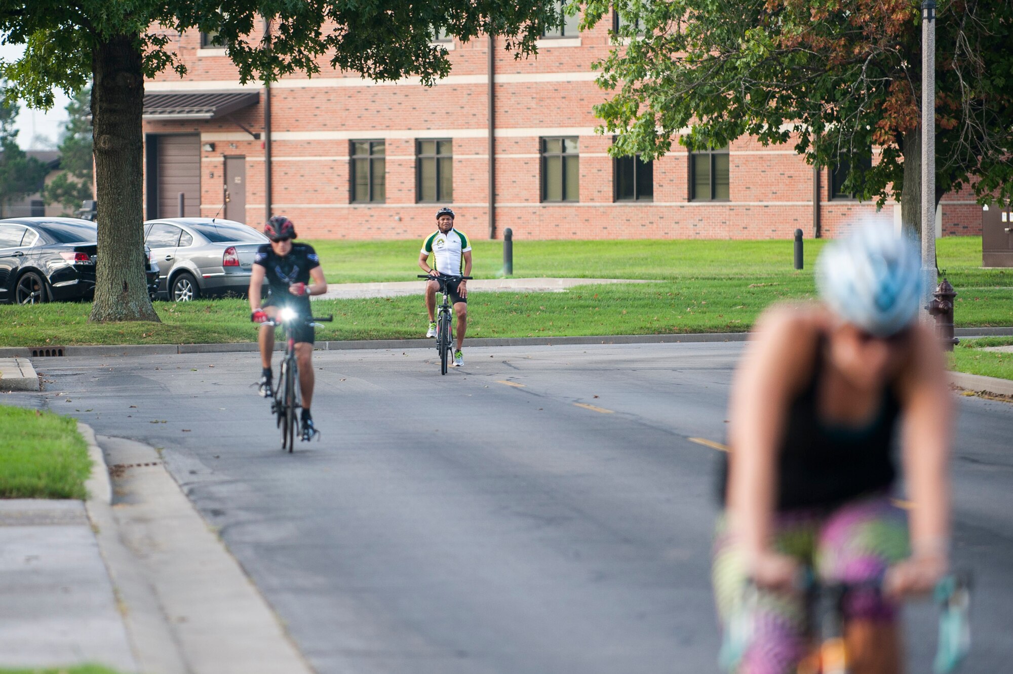 Team Scott members participate in the bike portion of the Surface Warrior Challenge at Scott Air Force Base, Ill., Aug. 27, 2016. The triathlon was hosted by the Military Surface Deployment and Distribution Command and featured participants from numerous units around the base including the 375th Air Mobility Wing, Air Mobility Command and U.S. Transportation Command. (U.S. Air Force photo by Staff Sgt. Clayton Lenhardt/Released)