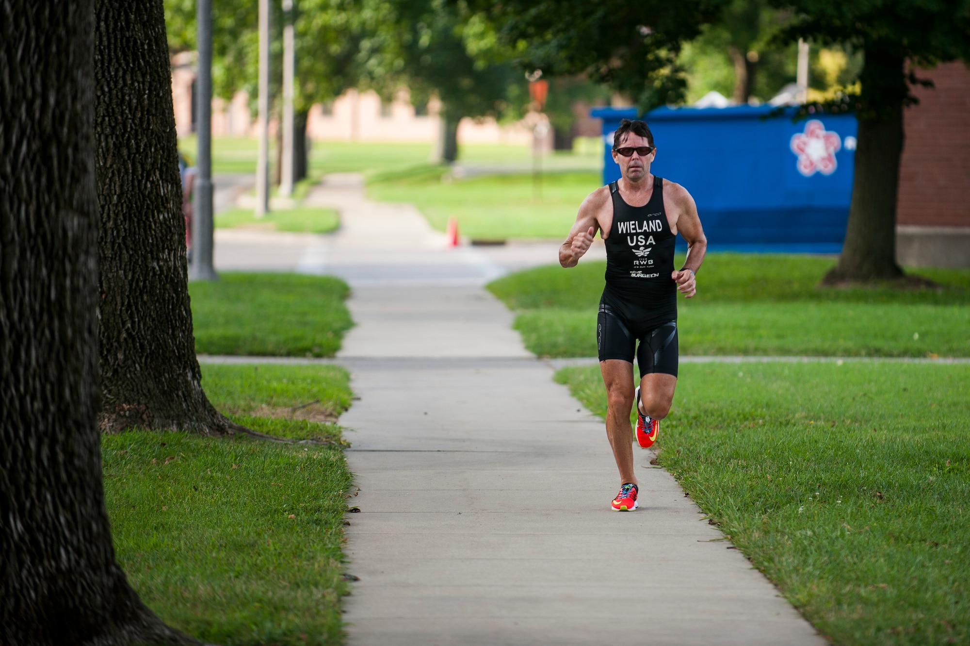 A Team Scott member participates in the run portion of the Surface Warrior Challenge at Scott Air Force Base, Ill., Aug. 27, 2016. Each portion of the triathlon featured a full and miniature competition. For the run portion, participants completed a 1.6 kilometer or 5 kilometer run. (U.S. Air Force photo by Staff Sgt. Clayton Lenhardt/Released)