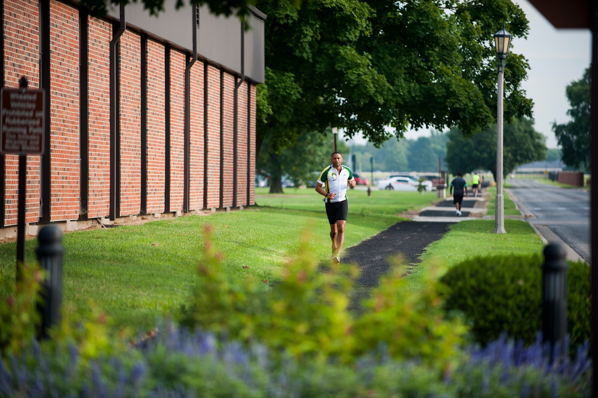 A Team Scott member participates in the run portion of the Surface Warrior Challenge at Scott Air Force Base, Ill., Aug. 27, 2016. The triathlon was hosted by the Military Surface Deployment and Distribution Command and featured both a full and miniature triathlon which included running, bicycling and swimming. (U.S. Air Force photo by Staff Sgt. Clayton Lenhardt/Released)