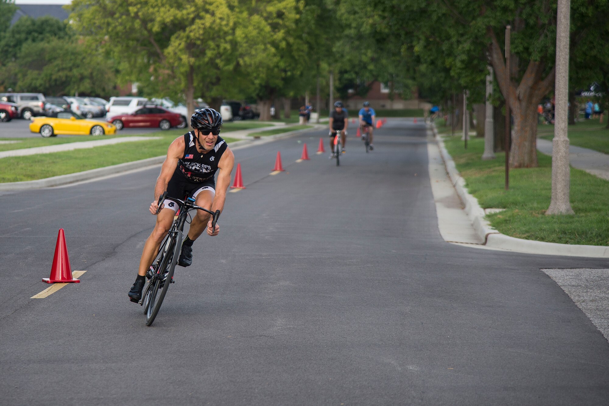A Team Scott member competes in the bicycle portion of the Surface Warrior Challenge, at Scott Air Force Base, Ill., Aug. 27, 2016. Each portion of the triathlon featured a full and miniature competition. For the bicycle portion, participants could either complete a 10.6 kilometer or a 31.8 kilometer bike ride. (U.S. Air Force photo by Tech. Sgt. Jonathan Fowler)