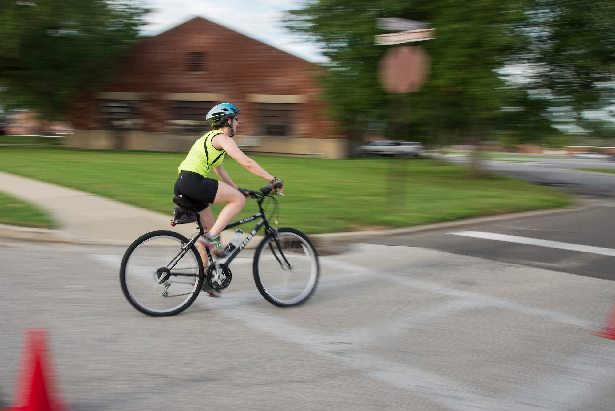 A Team Scott member competes in the bicycle portion of the Surface Warrior Challenge, at Scott Air Force Base, Ill., Aug. 27, 2016. Each portion of the triathlon featured a full and miniature competition. For the bicycle portion, participants could either complete a 10.6 kilometer or a 31.8 kilometer bike ride. (U.S. Air Force photo by Tech. Sgt. Jonathan Fowler)