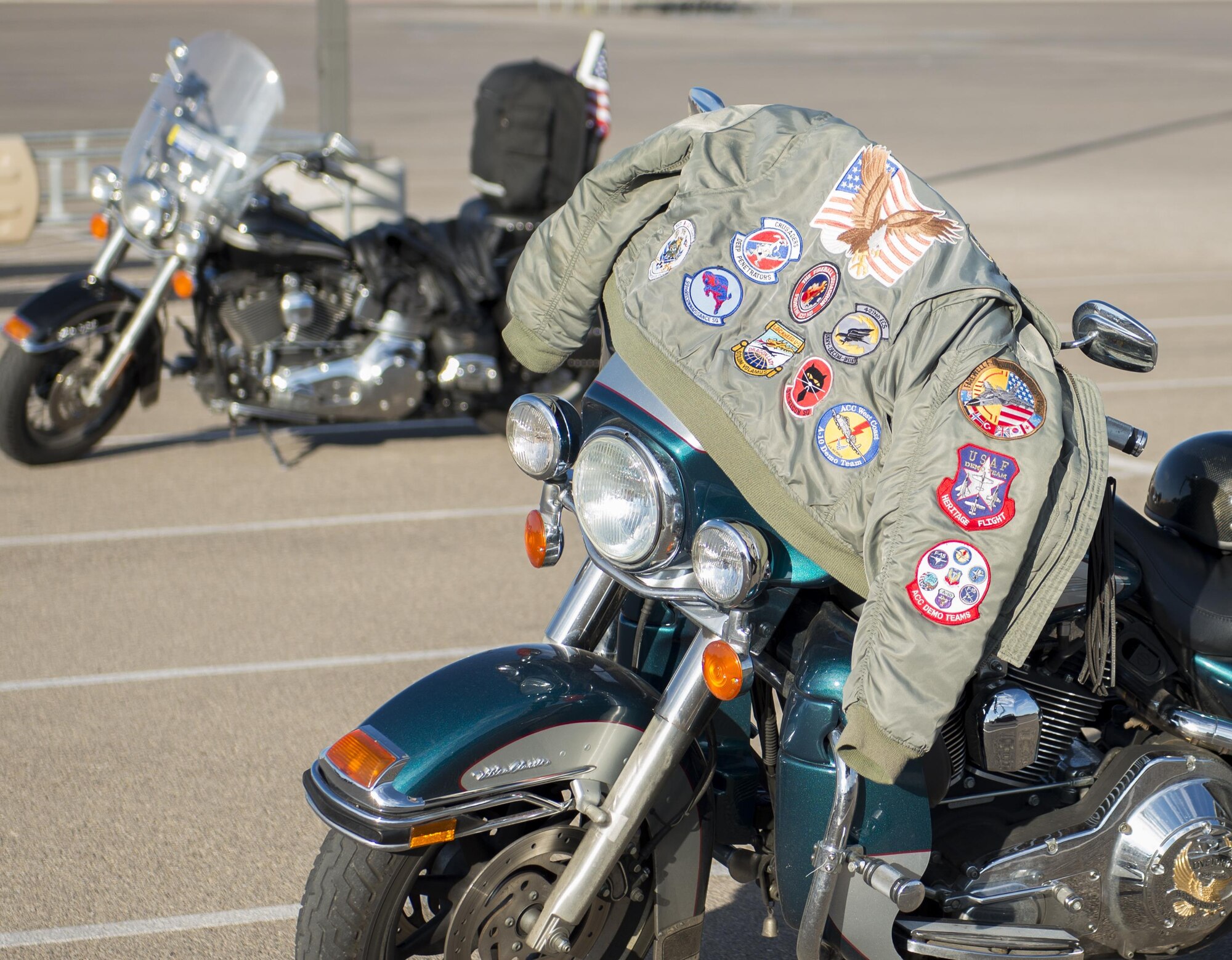 A jacket draped over a motorcycle bears patches from numerous Air Force squadrons Aug. 26, 2016 at Holloman Air Force Base, N.M. The 49th Wing Safety office hosts a ride every year to promote safe habits and improve riders’ skills. (U.S. Air Force photo by Airman 1st Class Randahl J. Jenson) 