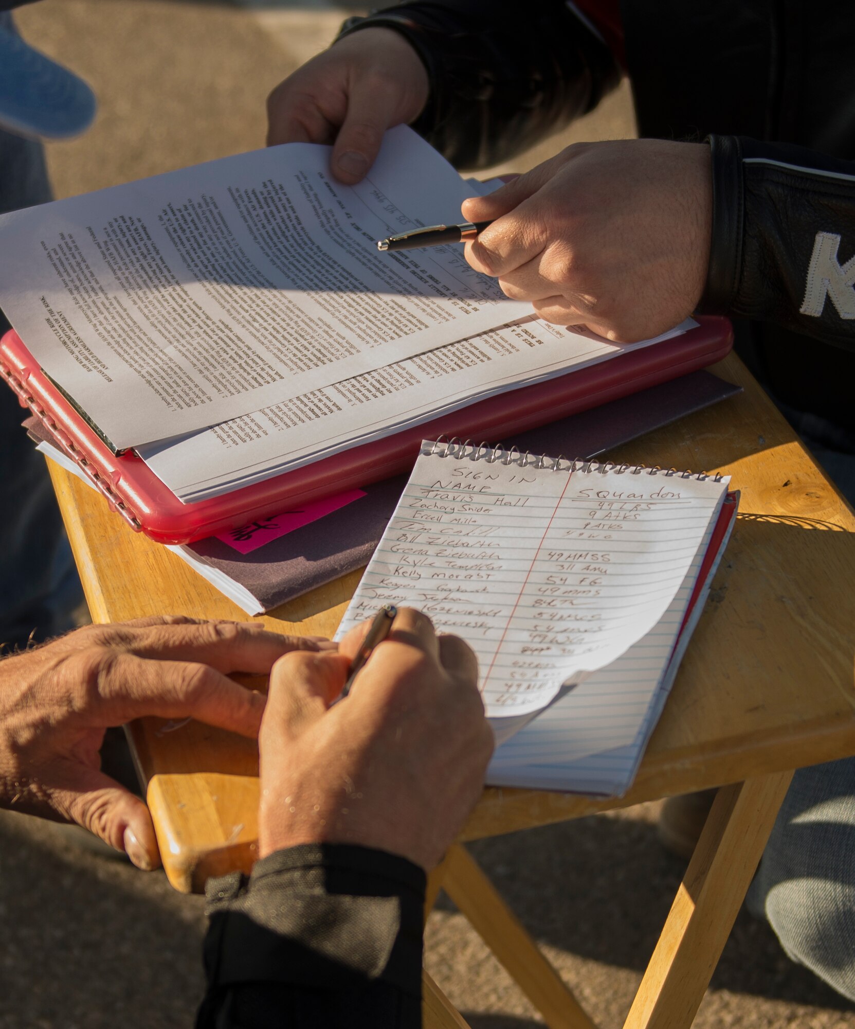 Motorcyclists sign in and fill out a waiver before Holloman’s 2016 Motorcycle Ride Aug. 26, 2016 at Holloman Air Force Base, N.M. The 100-mile ride was an opportunity for riders of all experience levels to practice safe habits and improve their skills. (U.S. Air Force photo by Airman 1st Class Randahl J. Jenson) 
