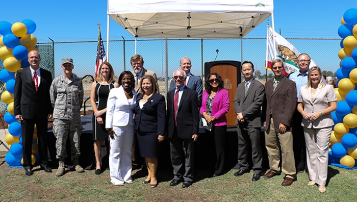 Brig. Gen. Russell A. Muncy, commander, 452nd Air Mobility Wing, March Air Reserve Base, poses for a photo with key stakeholders during a property transfer ceremony in the city of Norwalk, Calif. on Aug. 16, 2016. Approximately 15 acres of surplus land that used to be part of the Defense Fuel Supply Point Norwalk facility was donated to the community through the coordinated efforts of the city, Congress, March ARB, Headquarters Air Force and other key stakeholders.