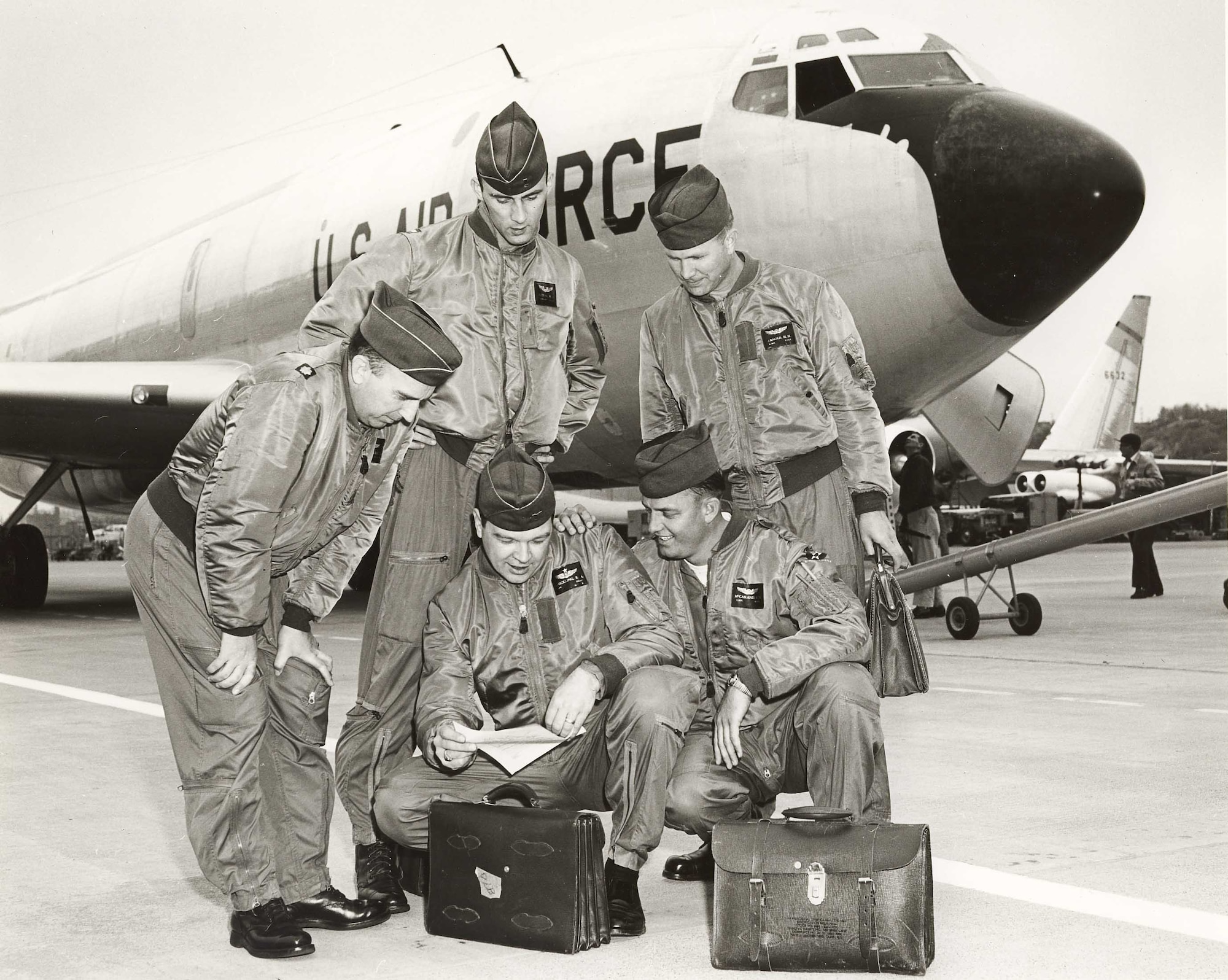 Retired Chief Master Sgt. Bobby McCasland, bottom right, a former crew chief, talks with crewmembers of the C-135 Stratolifter, tail number 55-3126, that was used to transport dignitaries under the command of then-Vice Chief of Staff of the Air Force Gen. Curtis E. LeMay from 1957-1965. McCasland, who was part of the crew that delivered the Air Force’s first KC-135 Stratotanker in June 1957, attended the KC-135’s 60th anniversary at McConnell Air Force Base, Aug. 31, 2016. (Courtesy photo)