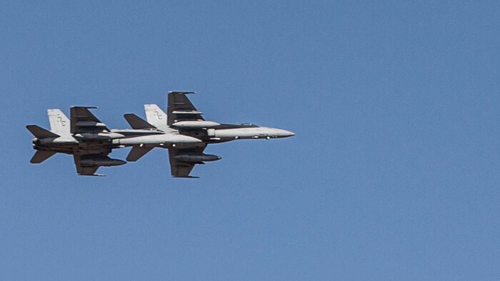 Two F/A-18C Hornets with Marine Fighter Attack Squadron (VMFA) 122 fly over head during Southern Frontier at Royal Australian Air Force Base Tindal, Australia, Aug. 31, 2016. The Hornet squadron trained in low-altitude tactics, building pilots’ confidence and skills with low flying while performing air-to-surface maneuvers simultaneously. Southern Frontier is a three week unit level training helping pilots gain experience and qualifications in low-altitude tactics, close air support, and air ground, high explosive ordnance delivery. 