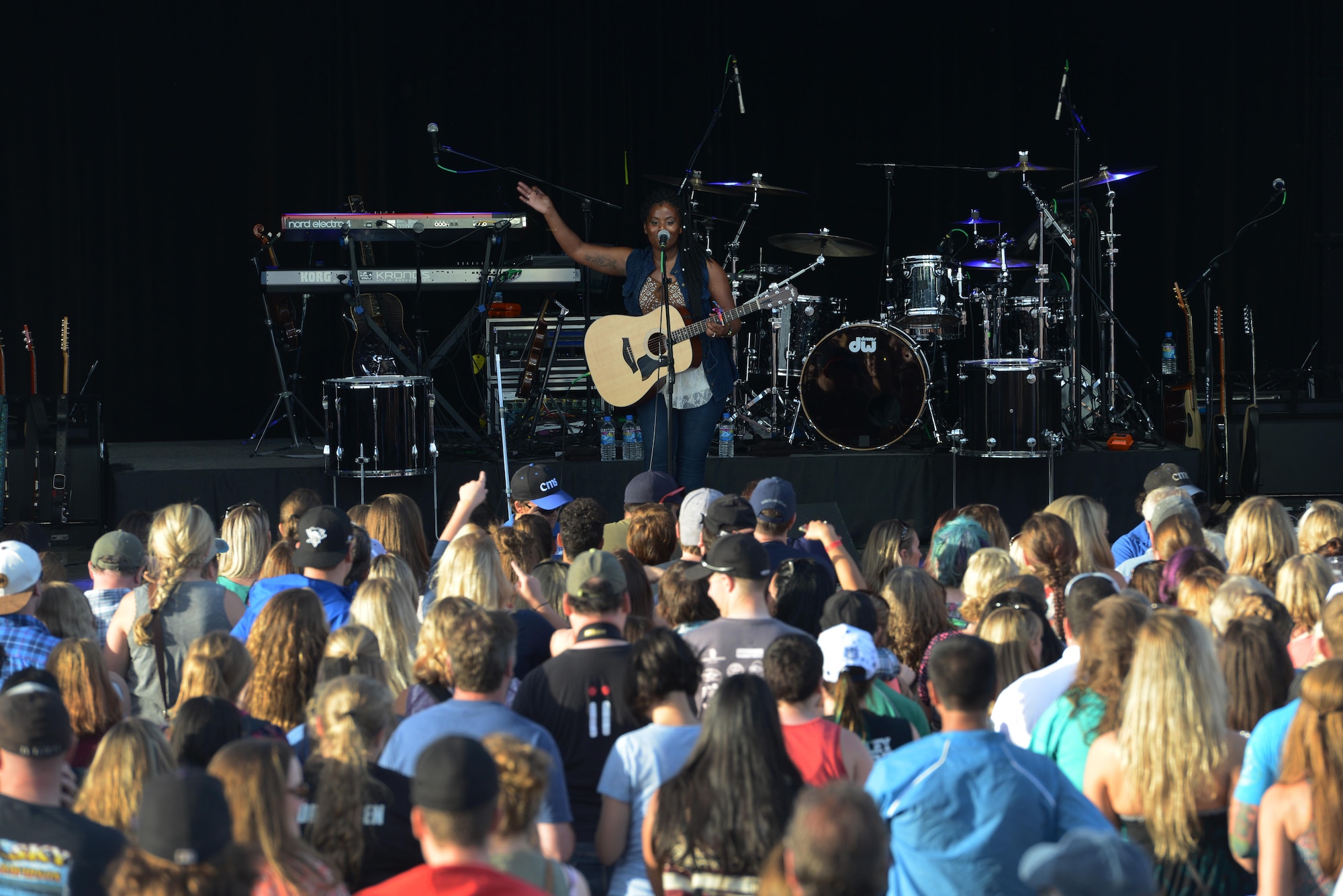 Senior Airman Rebeckah Hastings, 773d Logistics Readiness Squadron transportation journeyman, performs at the Alaska State Fair Aug. 27, 2016. She sang two country songs as an opening to The Band Perry. (U.S. Air Force photo by Airman 1st Class Christopher R. Morales)