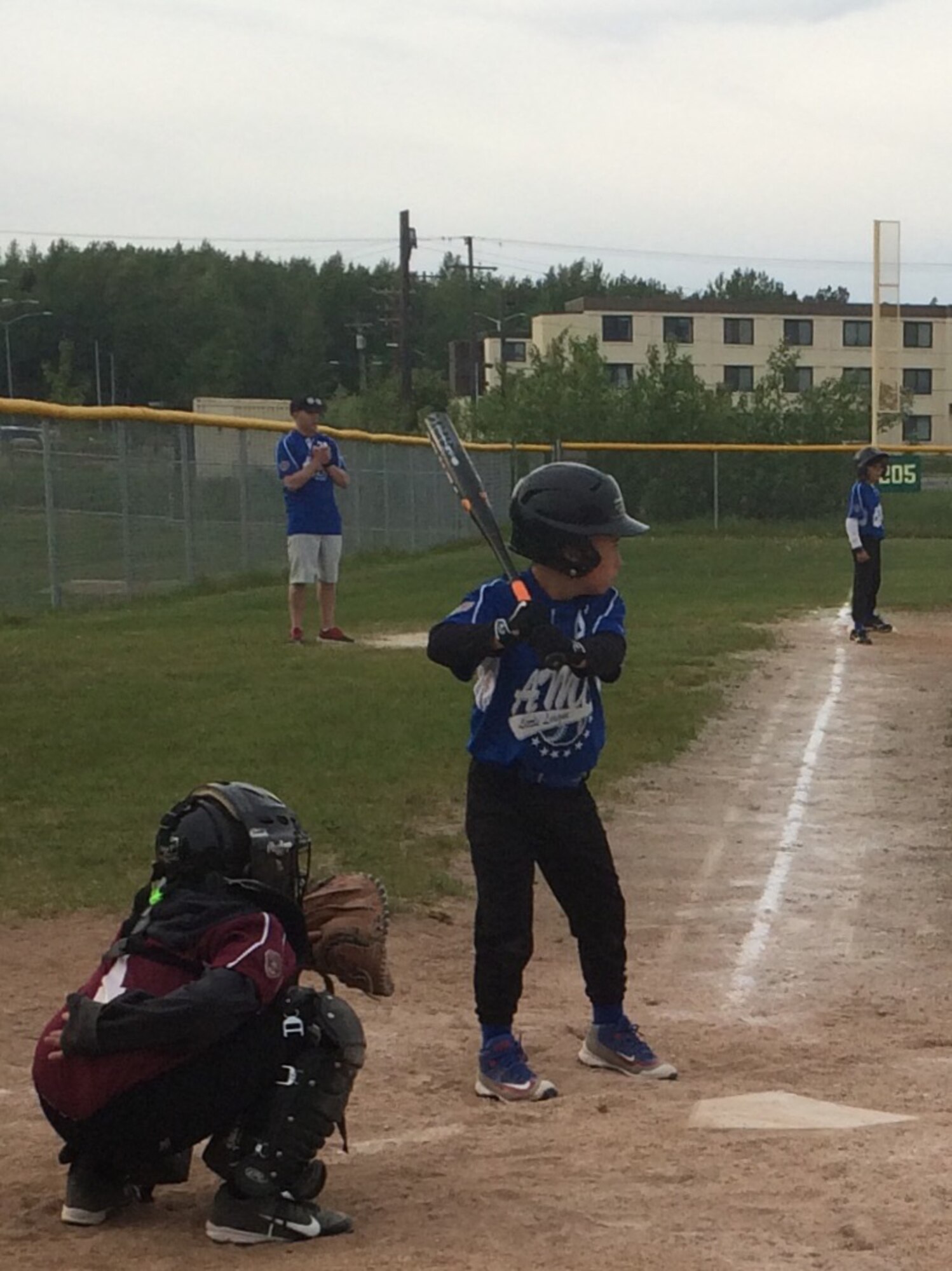 Alex Hart, Joint Base Elmendorf-Richardson Youth Sports participant, awaits a pitch during a competitive baseball game. Alex participated in a variety of JBER youth sports for three consecutive years, choosing to commit to both summer and after-school programs. (courtesy photo)