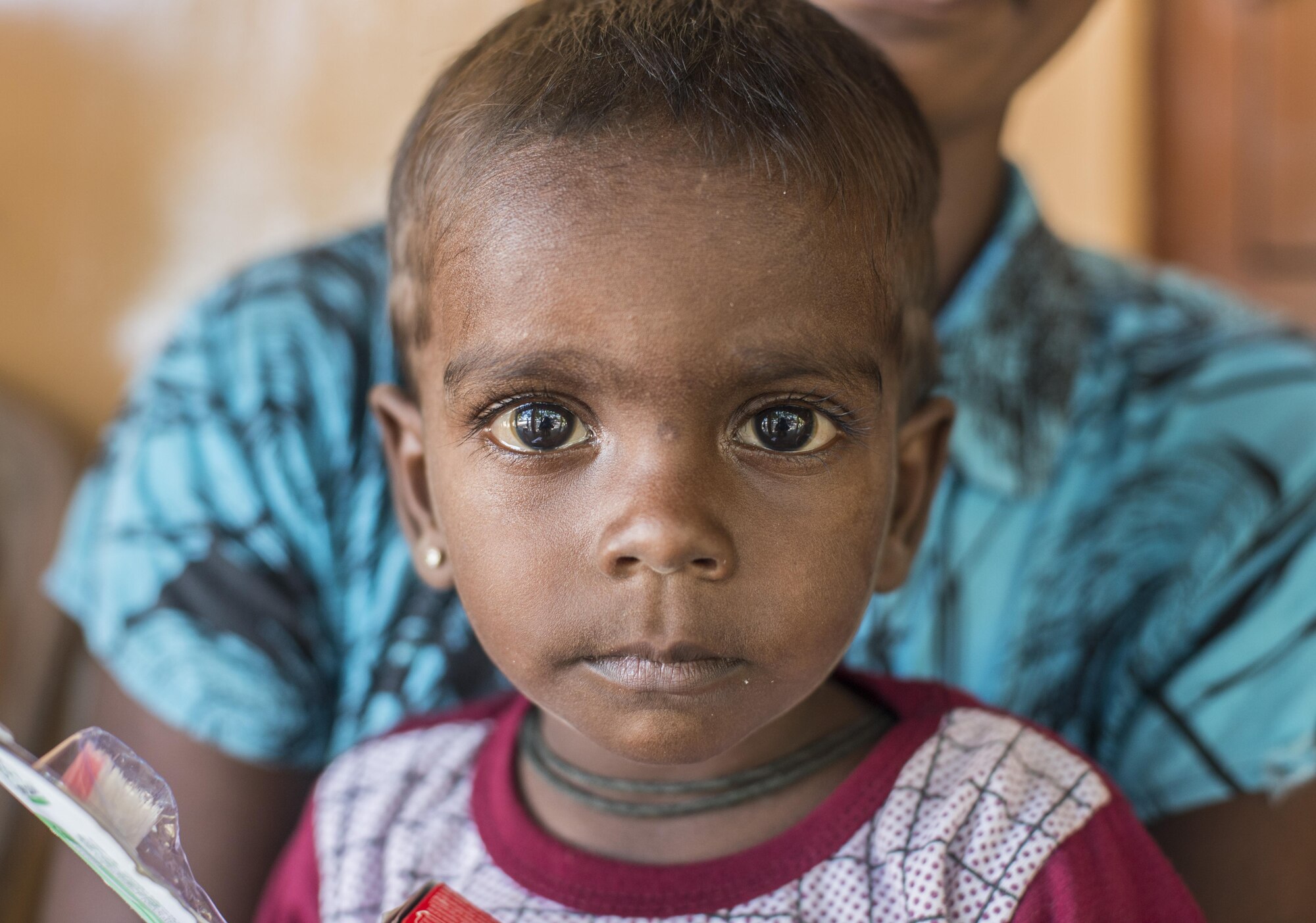 Sri Lankan child hold tooth brush during Pacific Angel 16-3 (PACANGEL) in Jaffna, Sri Lanka, Aug. 20, 2016. PACANGEL is a total force, joint and combined humanitarian assistance/civil military operation led by U.S. Pacific Air Forces. Assistance during PACANGEL included general health, dental, optometry and physical therapy. (U.S. Air Force photo by Senior Airman Brittany A. Chase)
