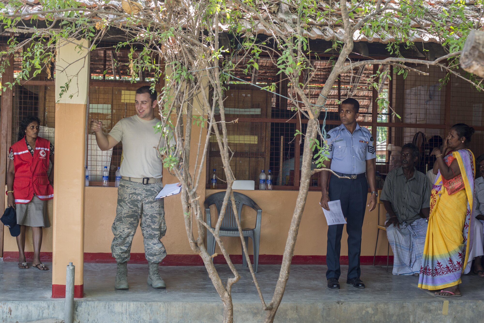 U.S. Air Force Tech. Sgt. Nicholas Hubbard, 18th Medical Group optometry technician, points to an eye chart during Pacific Angel (PACANGEL) 16-3 in Jaffna, Sri Lanka, Aug. 17, 2016. PACANGEL is a total force, joint and combined humanitarian assistance/civil military operation led by U.S. Pacific Air Forces. Assistance during PACANGEL included general health, dental, optometry and physical therapy. (U.S. Air Force photo by Senior Airman Brittany A. Chase)