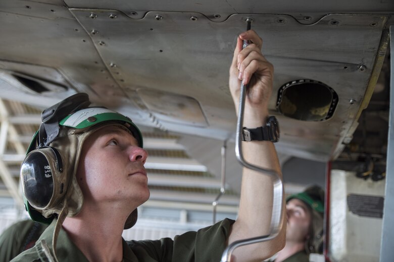 U.S. Marine Corps Lance Cpl. Matt Heidtman, an airframes Marine with Marine Fighter Attack Squadron (VMFA) 122, tightens fasteners on an F/A-18C Hornet during Southern Frontier at Royal Australian Air Force Base Tindal, Australia, Aug. 31, 2016. The Marines perform maintenance on the aircraft in preparation for departure at the conclusion of Southern Frontier. This three week unit level training that helps pilots gain experience and qualifications in low-altitude tactics, close air support, and air ground, high explosive ordnance delivery. (U.S. Marine Corps photo by Cpl. Nicole Zurbrugg)