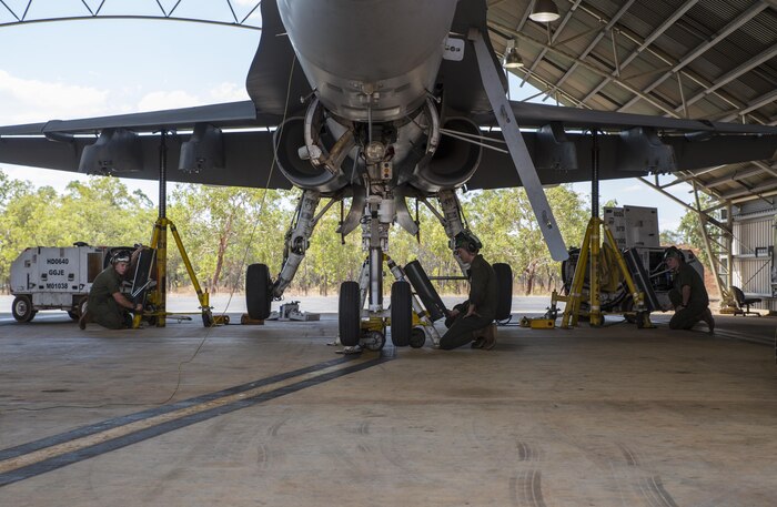 U.S. Marines assigned to Marine Fighter Attack Squadron (VMFA) 122 prepare to lower an F/A-18C Hornet during Southern Frontier at Royal Australian Air Force Base Tindal, Australia, Aug. 31, 2016. In preparation for departure from Australia, the squadron performs maintenance on all aircraft to ensure they are ready to make the long flight home. Southern Frontier is a three week unit level training that helps pilots gain experience and qualifications in low-altitude tactics, close air support, and air ground, high explosive ordnance delivery. (U.S. Marine Corps photo by Cpl. Nicole Zurbrugg)