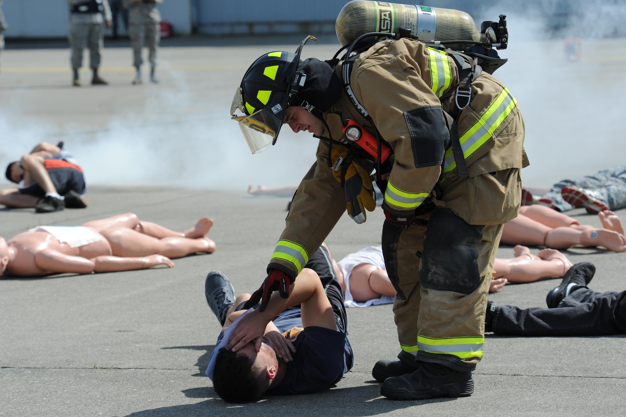 U.S. Air Force Airman 1st Class Brandon Cotham, a fireman assigned to the 35th Civil Engineer Squadron, conducts a patient assessment during a bilateral emergency management exercise at Misawa Air Base, Japan, Aug. 31, 2016. Firemen assessed patient damage and escorted them to a safe zone. (U.S. Air Force photo by Tech. Sgt. April Quintanilla)