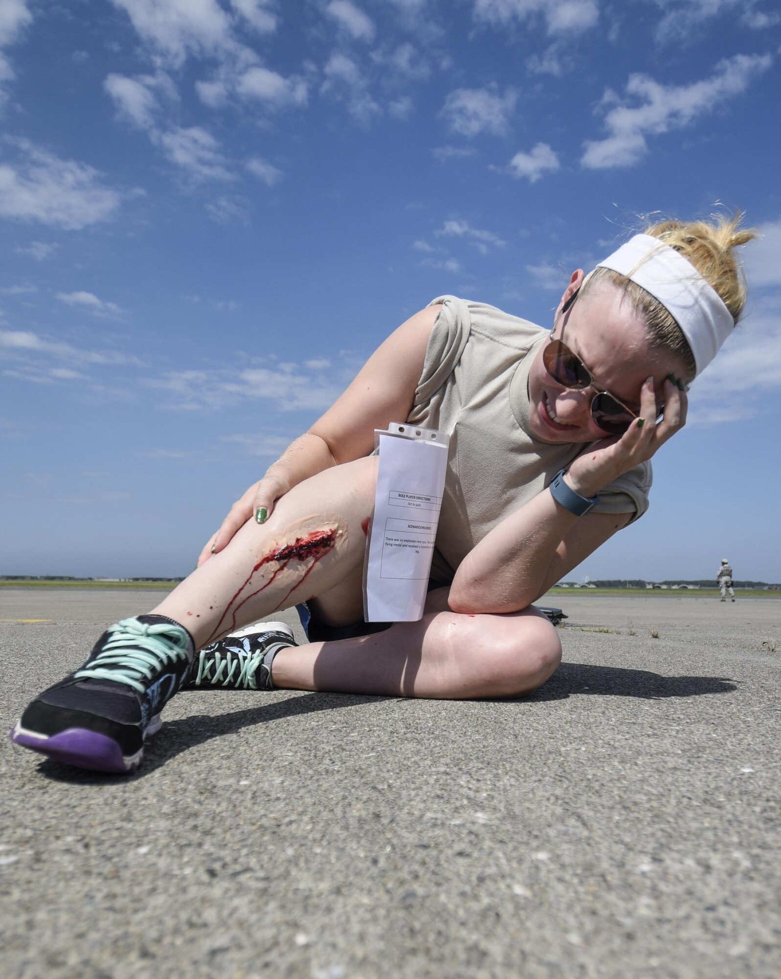 Rebecca Goebel, volunteer, participates in a bilateral emergency management exercise as a victim at Misawa Air Base, Japan, Aug. 31, 2016. Role playing victims suffered from a range of injuries such as being hit by metal shrapnel to disembowelment, which medical staff were tasked to respond and treat. (U.S. Air Force photo by Airman 1st Class Sadie Colbert)