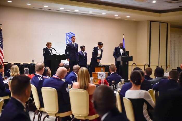 Senior Noncommissioned Officer Induction participants light ceremonial candles during the SNCO Induction program Aug. 18, 2016 at Joint Base Charleston, South Carolina. The ceremony is held annually to recognize Airmen recently promoted to the rank of Master Sergeant. (U.S. Air Force photo by Airman Megan Munoz/Released)