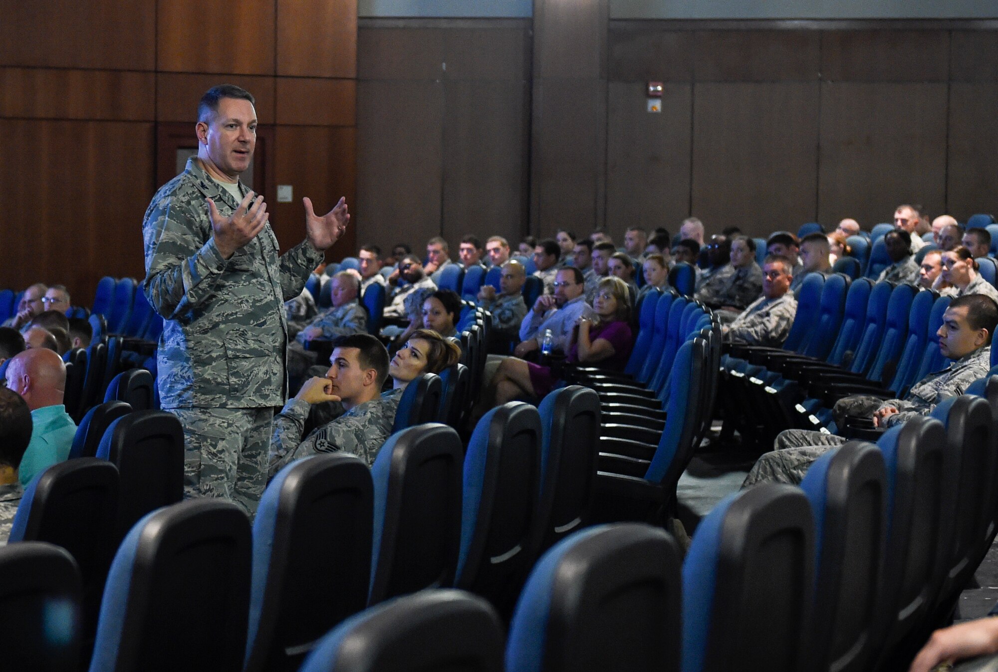 628th Airbase Wing commander Col. Robert Lyman speaks to Airmen during a commander’s call at Joint Base Charleston, South Carolina, Aug. 19, 2016. During the event, Airmen gave feedback and asked questions about current Air Force news. (U.S. Air Force photo by Staff Sgt. Andrea Salazar/Released)