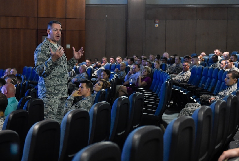 628th Airbase Wing commander Col. Robert Lyman speaks to Airmen during a commander’s call at Joint Base Charleston, South Carolina, Aug. 19, 2016. During the event, Airmen gave feedback and asked questions about current Air Force news. (U.S. Air Force photo by Staff Sgt. Andrea Salazar/Released)