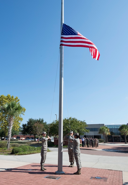 Team Charleston Airmen raise the American flag during a retreat ceremony recognizing Women’s Equality Day at Joint Base Charleston, South Carolina, Aug. 26, 2016. The day commemorates the passage of the 19th Amendment but also highlights the barriers women have overcome in their progress toward equality. (U.S. Air Force photo by Staff Sgt. Andrea Salazar/Released)