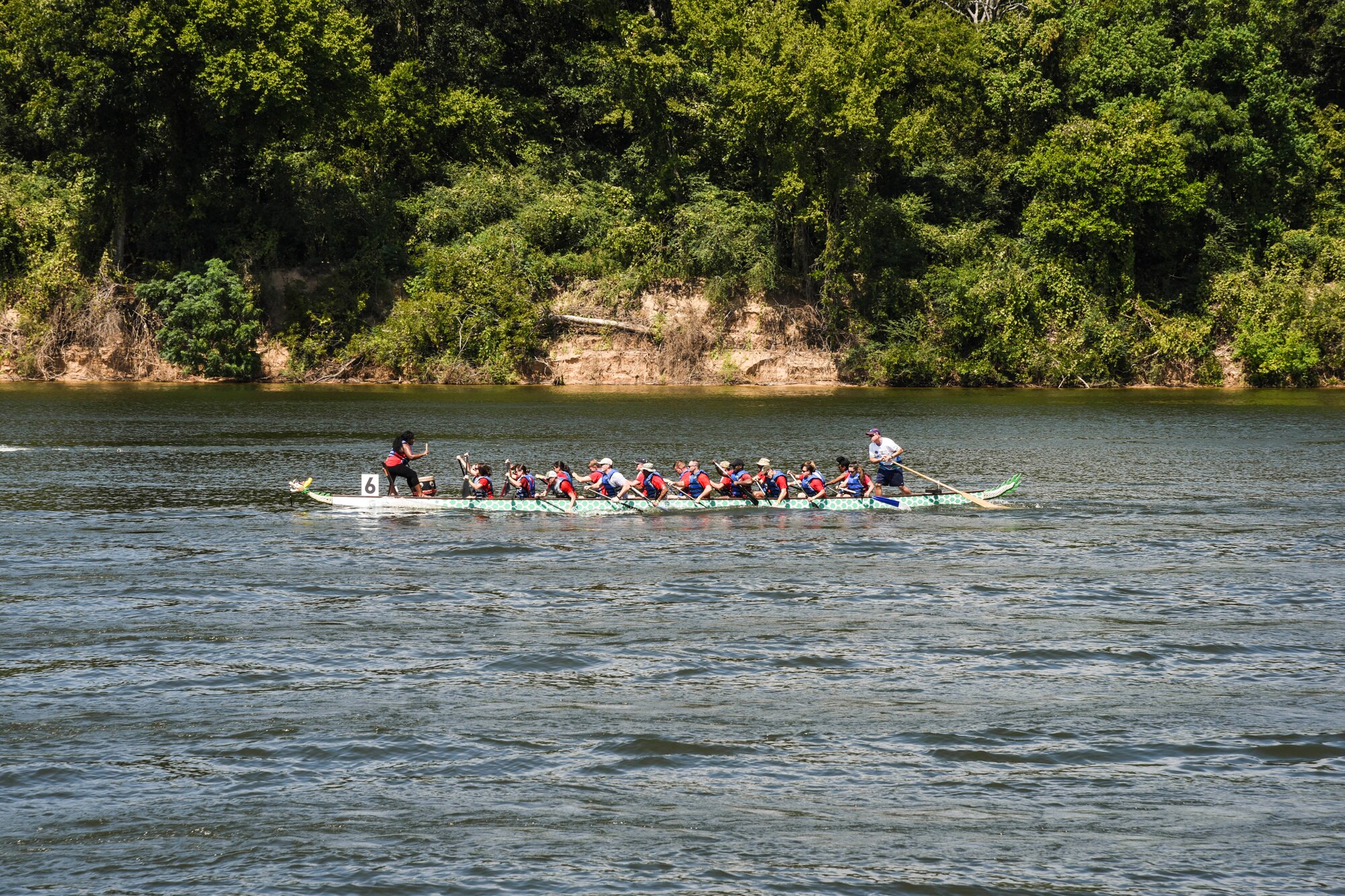 Members of the 187th Fighter Wing, Montgomery Regional Air National Guard Base, Ala., and their families race for the finish line Aug. 27, 2016, at the 7th annual Montgomery Dragon Boat Race and Festival at Riverfront Park in Montgomery, Ala. The team placed first in the second heat, and placed second in the third heat. (U.S. Air National Guard photo by Airman First Class Hayden Johnson)