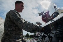 U.S. Air Force Airman Javier Gomez, 18th Civil Engineer Squadron firefighter, prepares a Pierce Enforcer for use Nov. 30, 2016, at Kadena Air Base, Japan. While on standby, the Pierce Enforcer undergoes multiple inspections to ensure mission readiness. (U.S. Air Force photo by Senior Airman Lynette M. Rolen/Released)