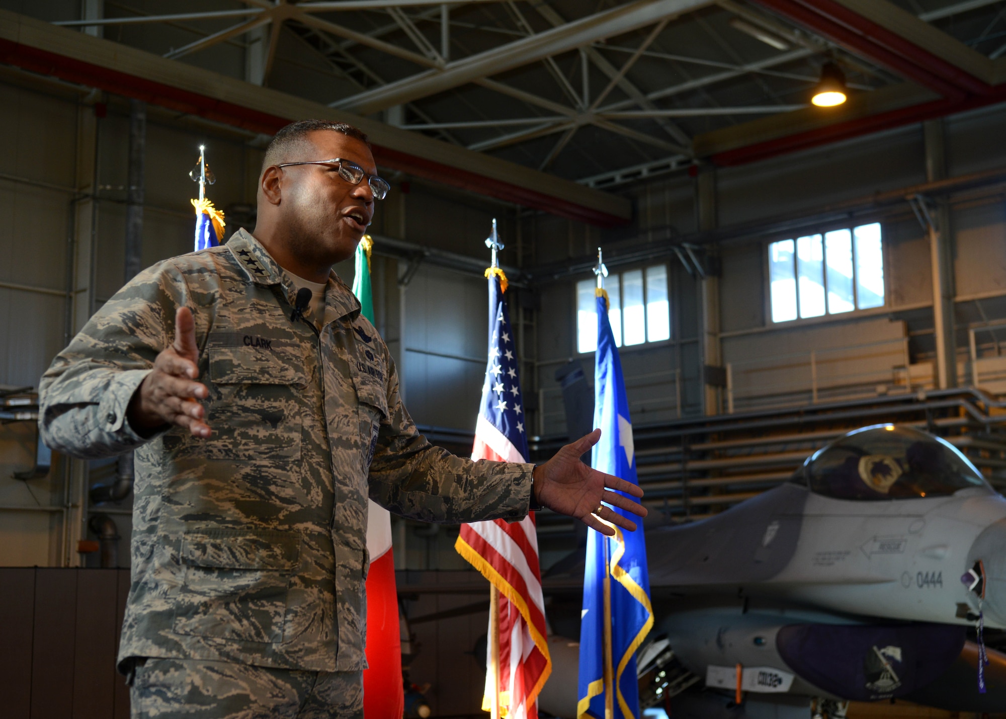 Lt. Gen. Richard Clark speaks to Airmen during an all call at Aviano Air Base, Italy on Nov. 30, 2016. Clark highlighted his top priorities of executing the mission, inspiring Airmen and taking care of family. (U.S. Air Force photo by Senior Airman Austin Harvill)