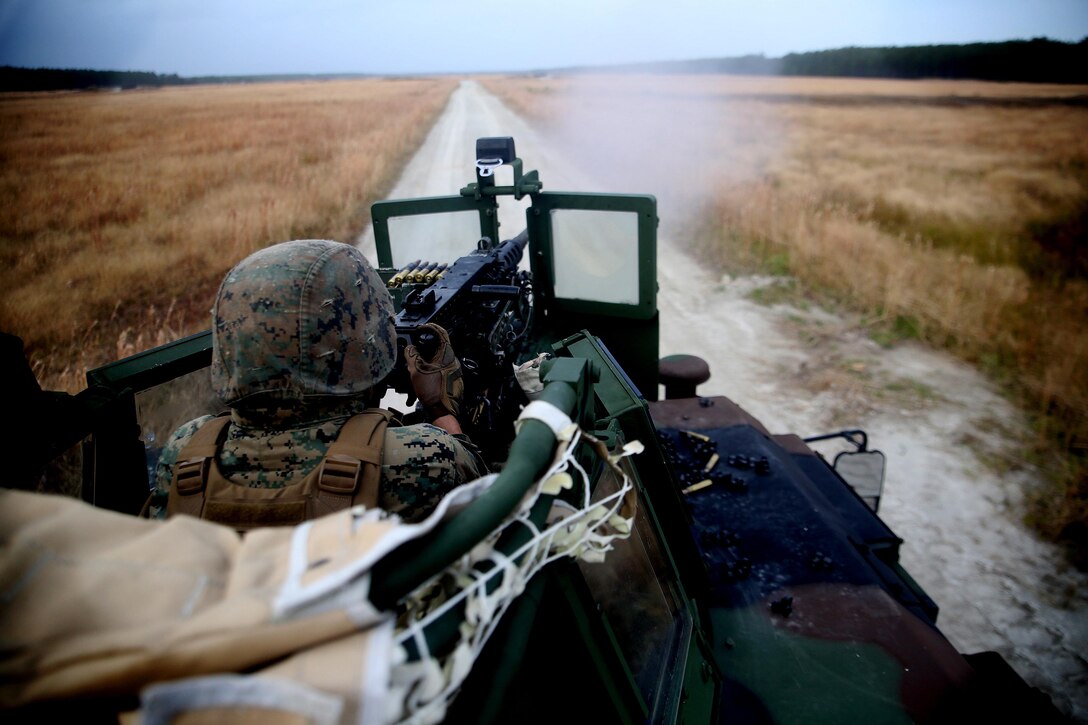 Private first class Alex Pelletier fires a .50 Cal. machine gun during a live-fire training exercise at Marine Corps Base Camp Lejeune, N.C., Nov. 29, 2016. Marines with Combined Anti-Armor team, Weapons Company, 2nd Battalion, 2nd Marine practiced vehicle buddy rushes with High Mobility Multipurpose Wheeled Vehicles to learn to communicate and move through an objective. Pelletier is a machine gunner with the unit. 