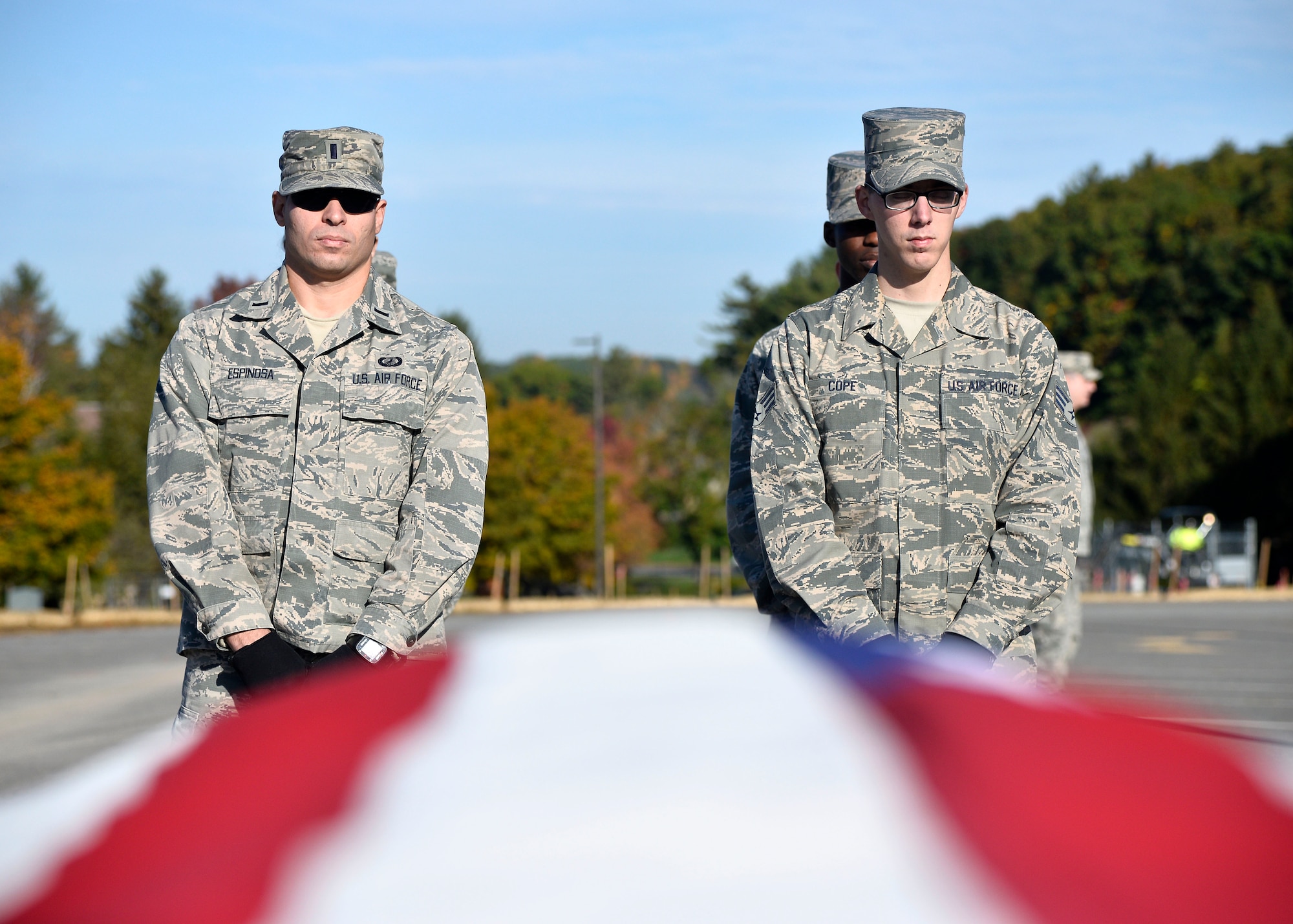 First Lt. Gabriel L. Espinosa, left, and Senior Airman Alec Cope, both members of the Patriot Honor Guard team, participate in a funeral honors training exercise at Hanscom Air Force Base, Mass., Oct. 20. The team provides military funeral honors throughout New England and parts of New York for active duty, retired members and veterans who served in the United States Air Force honorably. (U.S. Air Force photo by Mark Wyatt)