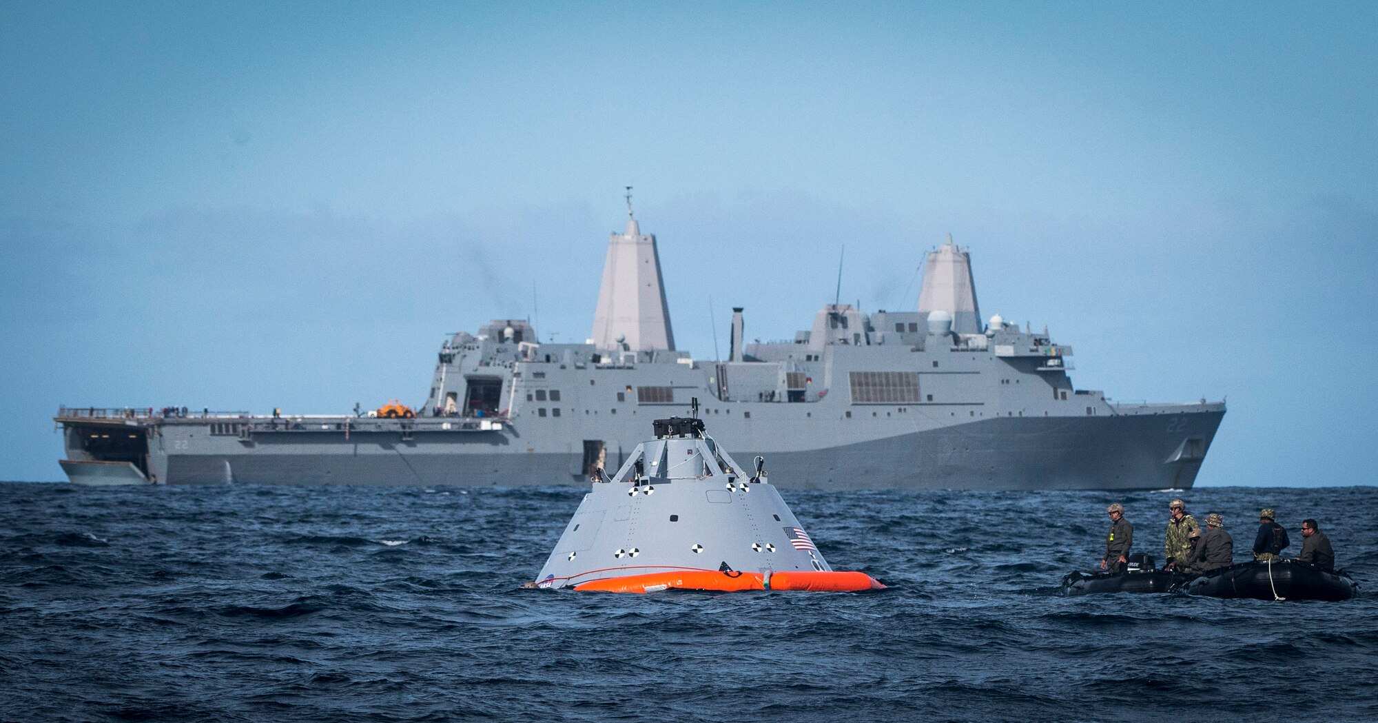 U.S. Navy Divers assigned to Explosive Ordnance Disposal Mobile Unit 3 and Mobile Dive and Salvage Company 3-1 prepare to tow a boilerplate-testing article, belonging to NASA’s Orion program, to the amphibious transport dock USS San Diego (LPD 22) in the Pacific Ocean Oct. 31, 2016. USS San Diego is currently conducting recovery operations with NASA’s Orion program; they are testing a new towing technique utilizing NASA and naval technology with the goal of reducing manning and increasing safety. (U.S. Navy Combat Camera photo by Petty Officer 1st Class Torrey W. Lee)