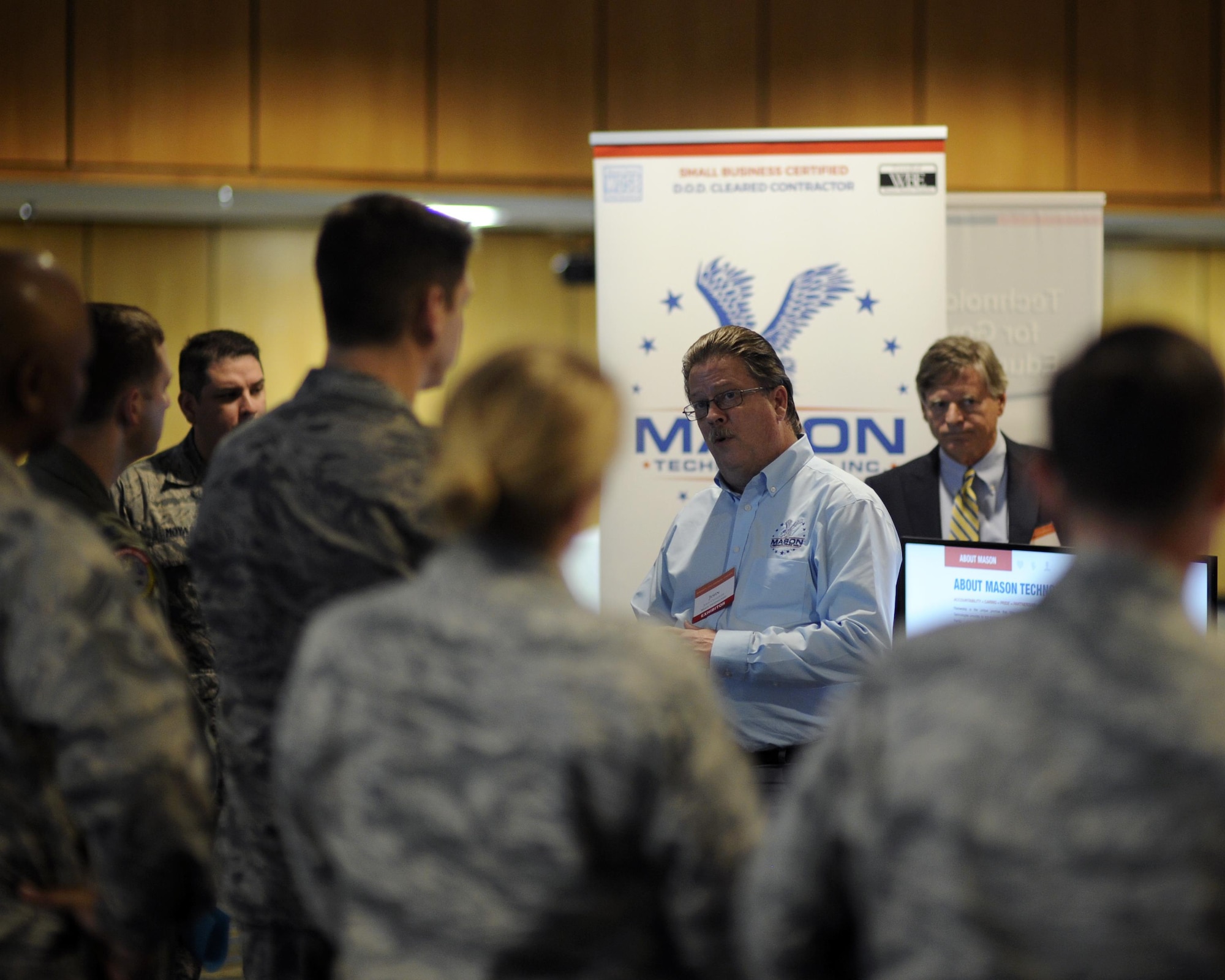 A participant of the semi-annual Technology Expo held at Tyndall, provides a briefing to Tyndall senior leadership in the Horizons Club Nov. 29, 2016. The event is hosted by Armed Forces Communications and Electronics Association at Tyndall and other Air Force installations in order to forge a relationship between the Department of Defense and technology industries to provide the most current solution for any mission. (U.S. Air Force photo by Senior Airman Solomon Cook/Released)