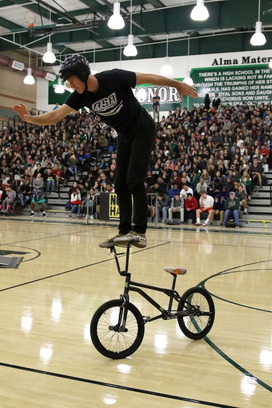 BMX rider Trevor Meyer performs a stunt at Monrovia High School in Monrovia, Calif., during the Action Sports Association Entertainment high-school tour with the U.S. Marines from Recruiting Sub Station Pasadena, Nov. 29, 2016. The ASA High School Tour is a high-energy action sports circuit that visits cities across the United States supporting the Anti-Defamation League’s No Place for Hate campaign and the campaign for Tobacco-Free Kids.  ASA brings in five of the world’s top professional skateboarders, inline skaters and BMX riders from the X Games to perform on a state-of-the-art half-pipe, while an emcee delivers an educational message in a fun, positive and interactive fashion.  Students can win prizes, get autographs and participate in a variety of contests with our partners. (U.S. Marine Corps photo by Staff Sgt. Alicia R. Leaders/Released) 