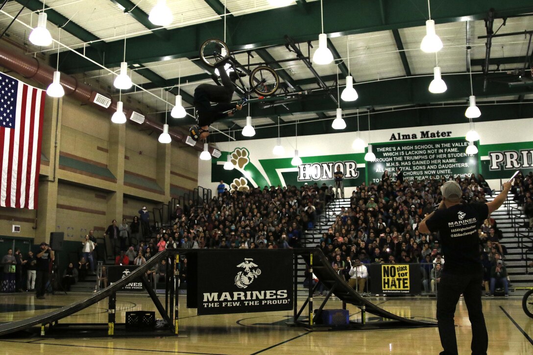 BMX rider Anthony Napolitan performs a flip at Monrovia High School in Monrovia, Calif., during the Action Sports Association Entertainment high-school tour with the U.S. Marines from Recruiting Sub Station Pasadena, Nov. 29, 2016. The ASA High School Tour is a high-energy action sports circuit that visits cities across the United States supporting the Anti-Defamation League’s No Place for Hate campaign and the campaign for Tobacco-Free Kids.  ASA brings in five of the world’s top professional skateboarders, inline skaters and BMX riders from the X Games to perform on a state-of-the-art half-pipe, while an emcee delivers an educational message in a fun, positive and interactive fashion.  Students can win prizes, get autographs and participate in a variety of contests with our partners. (U.S. Marine Corps photo by Staff Sgt. Alicia R. Leaders/Released) 