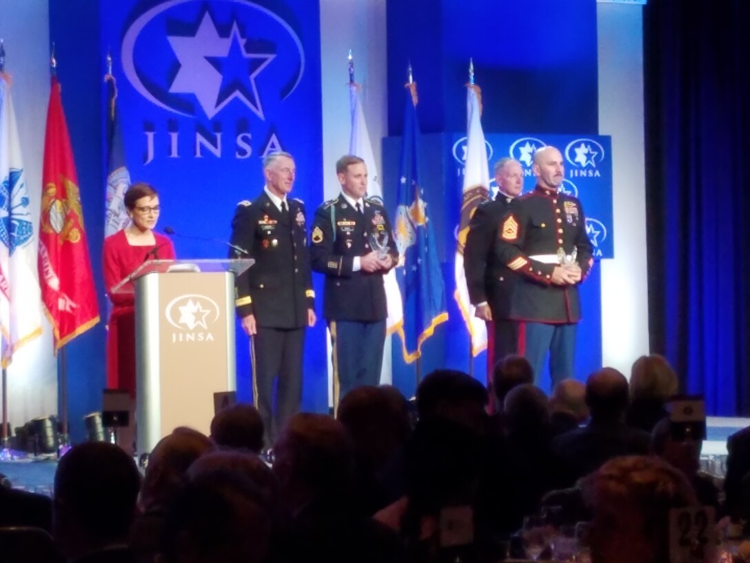 Photo 20161129_193218 from left to right: Master of
 Ceremonies, Mrs. Catherine Herridge, Chief Intelligence Correspondent, Fox
 News; Lieutenant General John F. Mulholland, U.S. Army; Staff Sergeant Jared
 W. Gabriel, U.S. Army; Gunnery Sergeant Craig J. Wilcox, U.S. Marine Corps;
 Lieutenant General Mark A. Brilakis, U.S. Marine Corps.

29 November 2016, Gunnery Sergeant Craig J. Wilcox was awarded
 the Grateful Nation Award. It is one of the Marine Corps "Outreach" Awards.
 Each branch of service was allotted one recipient. GySgt Wilcox was the
 Headquarters and Service Battalion nomination and he was selected to receive
 the award. They read a brief citation noting a few of the many incredible
 things GySgt Wilcox has done in his time.
