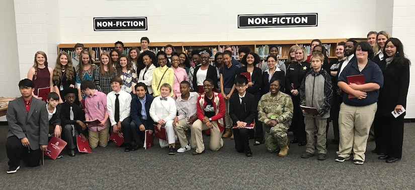 Furman Middle School students stand with Sumter community business leaders during career day Nov 16, 2016, at Furman Middle School. Six business, including U.S. Army Central, conducted round table discussions with students as part of the Sumter School District and Chamber of Commerce student career forum prior taking business tours Nov. 30, 2016. 