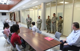 U.S. Army Central Soldiers discuss the many jobs available in the Army with students during the Furman Middle School career day Nov. 30, 2016, at Shaw Air Force Base, S.C. 